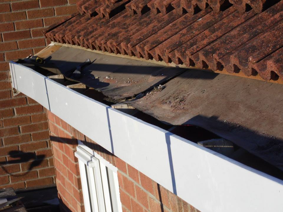 putting-the-new-fascia-boards-in-place putting the new uPVC fascia boards in place Wakefield
